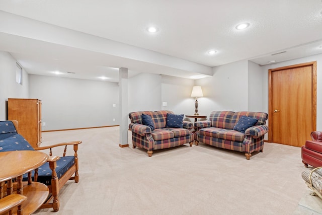 living area with recessed lighting, light colored carpet, and baseboards