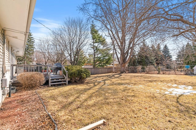 view of yard featuring a deck and fence private yard