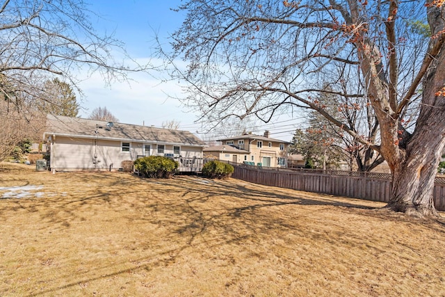 view of yard with a wooden deck and fence