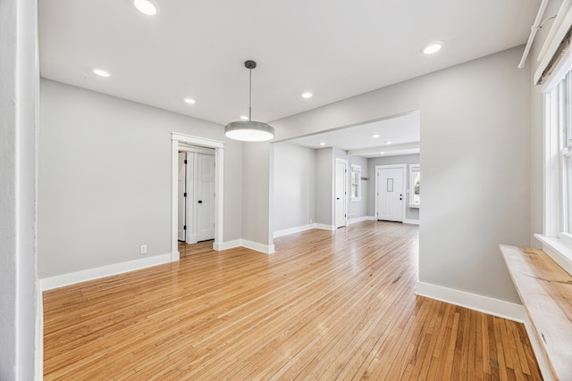 interior space with recessed lighting, baseboards, and light wood finished floors