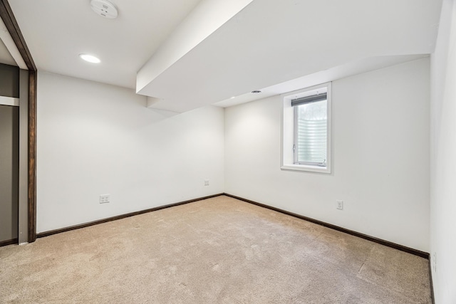 interior space featuring baseboards and carpet flooring