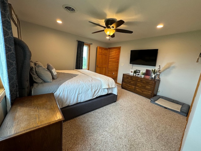 bedroom with a ceiling fan, visible vents, carpet flooring, and recessed lighting