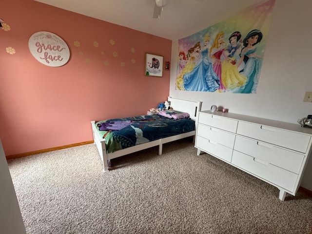 bedroom with ceiling fan, carpet flooring, and baseboards