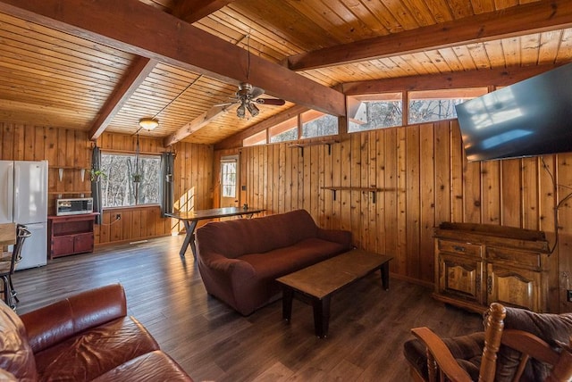 living area with lofted ceiling with beams, wood walls, wooden ceiling, and wood finished floors