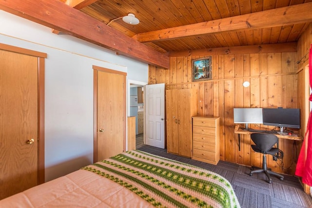 carpeted bedroom with beam ceiling, wooden ceiling, and wood walls