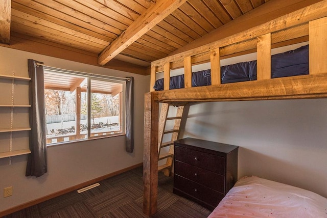 bedroom featuring wooden ceiling, visible vents, beamed ceiling, and baseboards