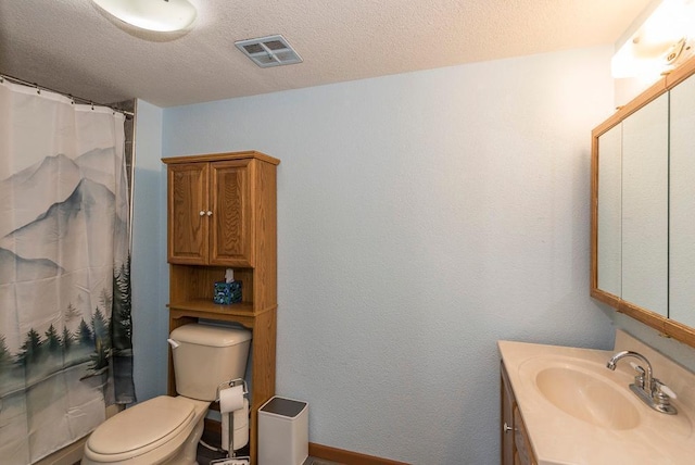 bathroom featuring visible vents, toilet, a shower with curtain, a textured ceiling, and vanity