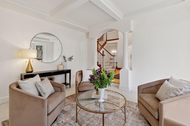 sitting room with beam ceiling, light carpet, decorative columns, and stairway