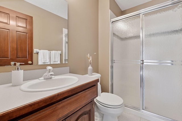 full bathroom with toilet, a stall shower, and vanity