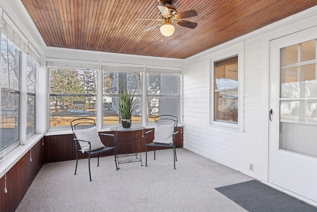 sunroom with wooden ceiling and ceiling fan