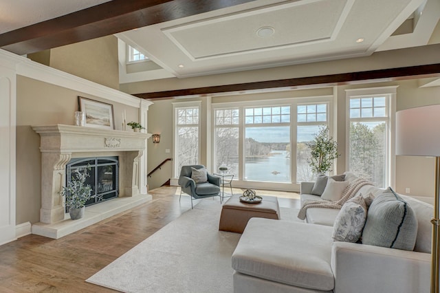 795 140th Ave, New Richmond, WI 54017 - living area with healthy amount of natural light, a glass covered fireplace, wood finished floors, and recessed lighting