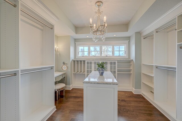 795 140th Ave, New Richmond, WI 54017 - walk in closet with a chandelier, dark wood-style flooring, and a raised ceiling