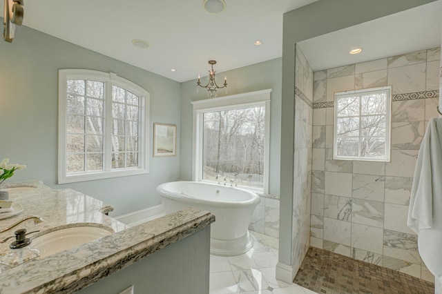 795 140th Ave, New Richmond, WI 54017 - bathroom with plenty of natural light, a freestanding bath, marble finish floors, vanity, and recessed lighting
