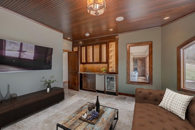 795 140th Ave, New Richmond, WI 54017 - living room featuring beverage cooler, stone tile floors, wet bar, recessed lighting, and baseboards
