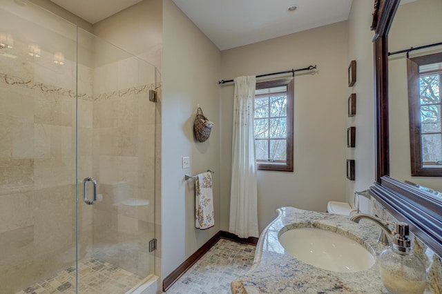 795 140th Ave, New Richmond, WI 54017 - bathroom featuring a stall shower, baseboards, vanity, and toilet