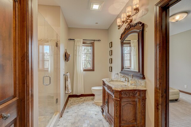 795 140th Ave, New Richmond, WI 54017 - bathroom featuring vanity, a stall shower, baseboards, and toilet