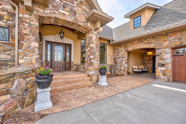 795 140th Ave, New Richmond, WI 54017 - doorway to property featuring stone siding and stucco siding