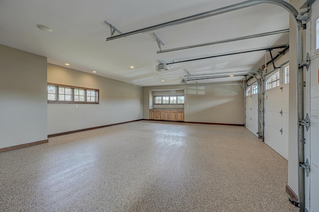 795 140th Ave, New Richmond, WI 54017 - garage featuring recessed lighting, baseboards, and a garage door opener