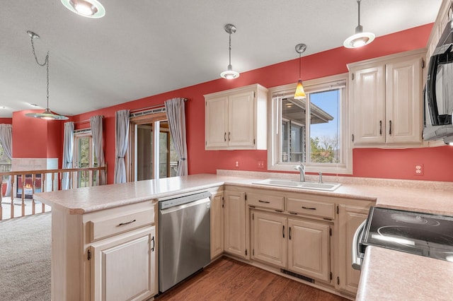 kitchen with a peninsula, range with electric stovetop, light countertops, a sink, and dishwasher