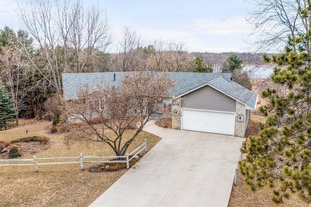 single story home featuring fence, a shingled roof, driveway, and a garage