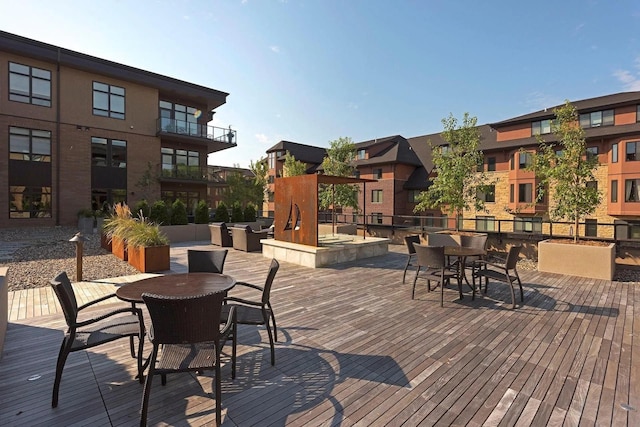 wooden deck featuring outdoor dining space