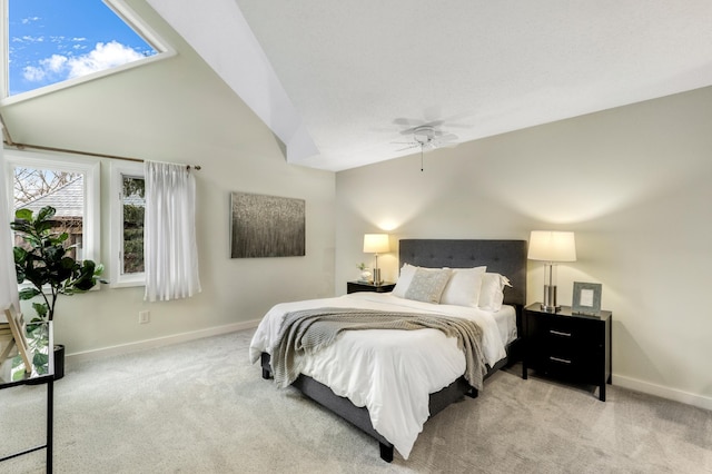 carpeted bedroom featuring a ceiling fan, lofted ceiling, and baseboards