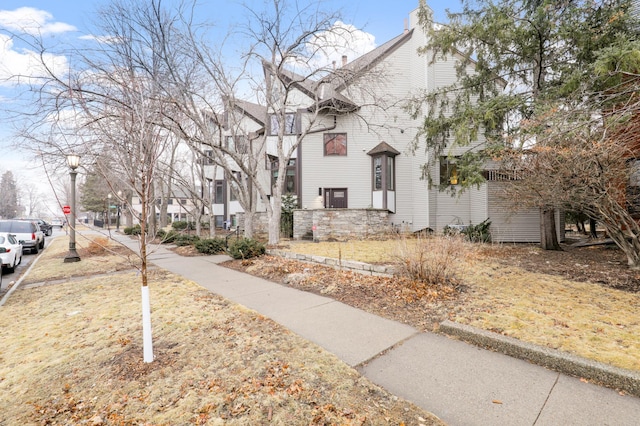 view of side of home featuring a residential view