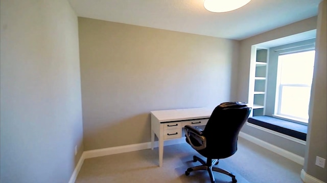 home office featuring carpet flooring and baseboards