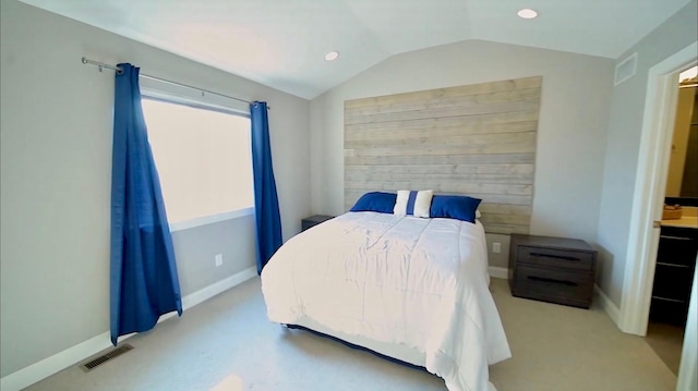 bedroom with lofted ceiling, visible vents, baseboards, and recessed lighting