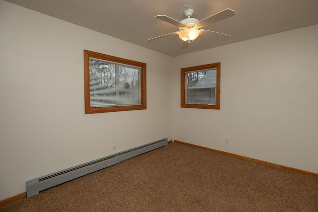 empty room with baseboard heating, carpet flooring, and baseboards