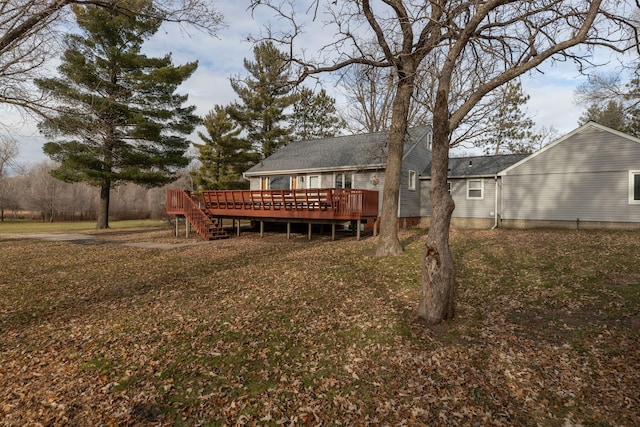 back of house featuring a wooden deck