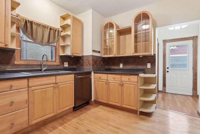 kitchen with a sink, light wood-style flooring, open shelves, and dishwasher