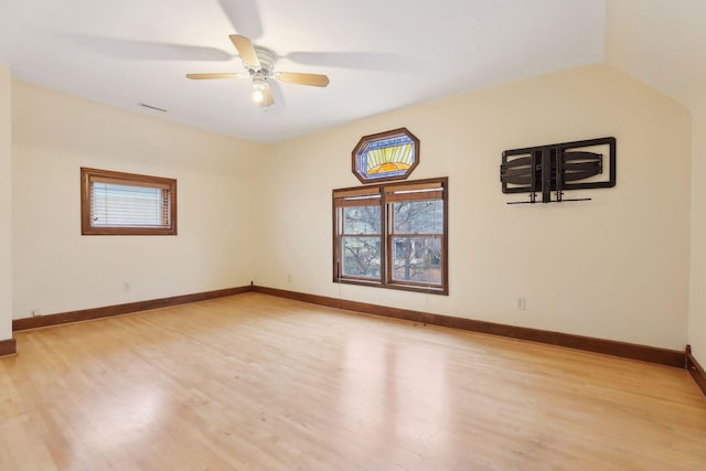 unfurnished room with light wood-style flooring, visible vents, baseboards, and ceiling fan