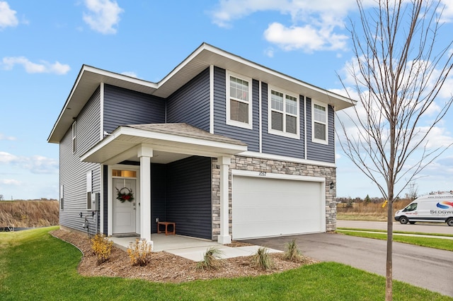 view of front facade featuring aphalt driveway, stone siding, an attached garage, and a front yard