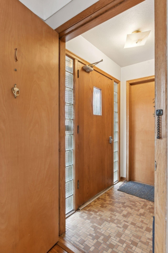 foyer entrance with brick floor