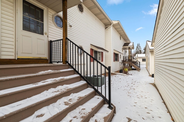 view of snow covered property entrance