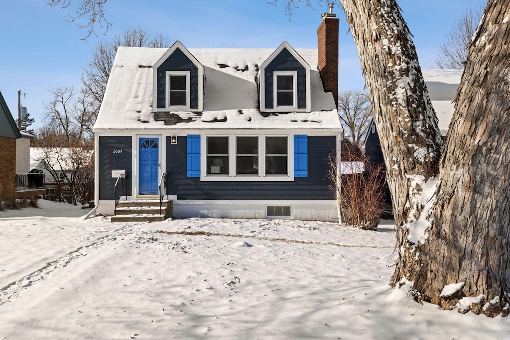 cape cod home with a chimney