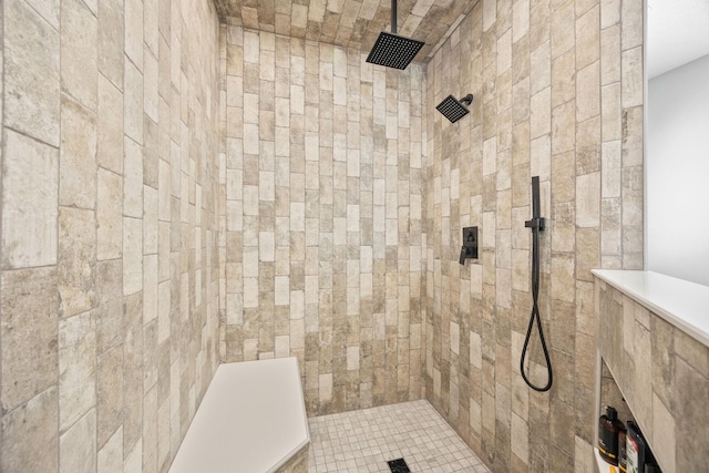 bathroom with a tile shower