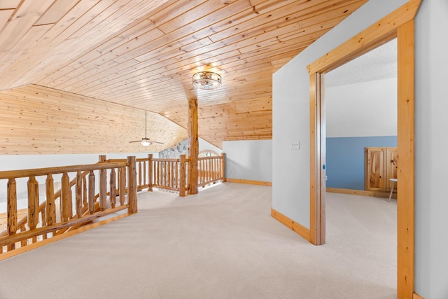 additional living space with wooden ceiling, carpet flooring, vaulted ceiling, and baseboards