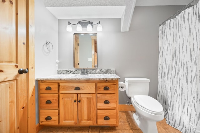 full bathroom featuring a shower with curtain, vanity, toilet, and tile patterned floors