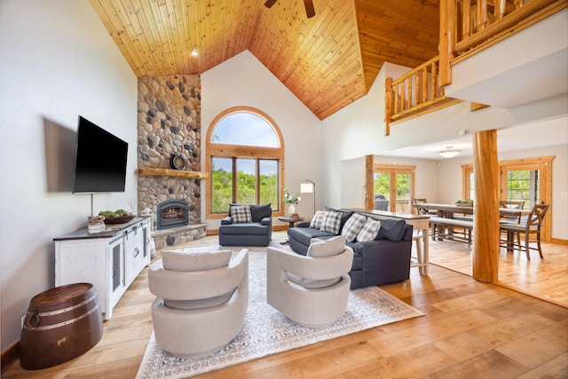 29235 Piney Way, Breezy Point, MN 56472 - living area with light wood-style flooring, wooden ceiling, high vaulted ceiling, a ceiling fan, and a stone fireplace