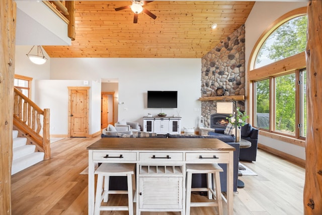 29235 Piney Way, Breezy Point, MN 56472 - living area featuring high vaulted ceiling, plenty of natural light, baseboards, light wood-type flooring, and wood ceiling