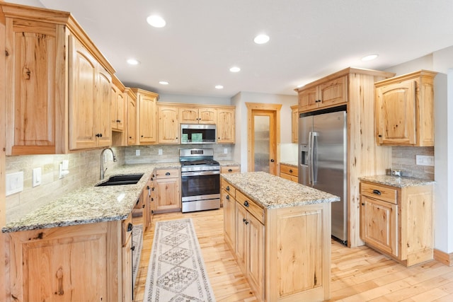 29235 Piney Way, Breezy Point, MN 56472 - kitchen with stainless steel appliances, a sink, light brown cabinetry, light wood-style floors, and recessed lighting