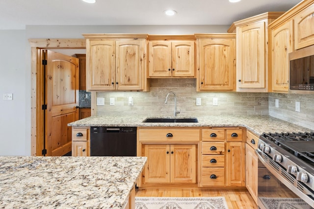 29235 Piney Way, Breezy Point, MN 56472 - kitchen with a sink, appliances with stainless steel finishes, light brown cabinetry, light stone counters, and recessed lighting