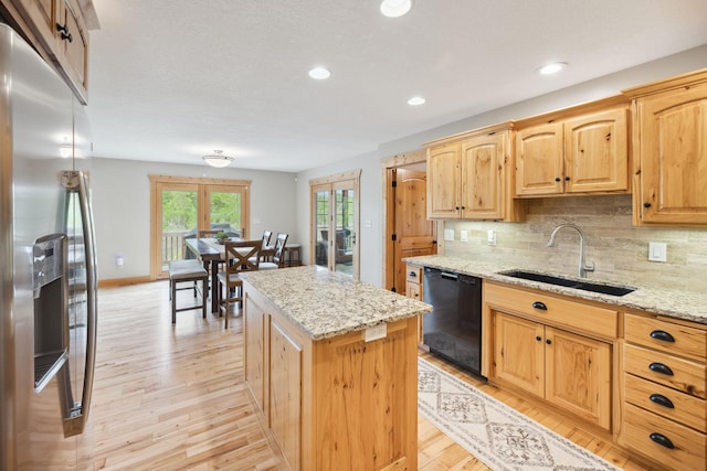 29235 Piney Way, Breezy Point, MN 56472 - kitchen featuring stainless steel fridge, dishwasher, a sink, light wood-style flooring, and a center island