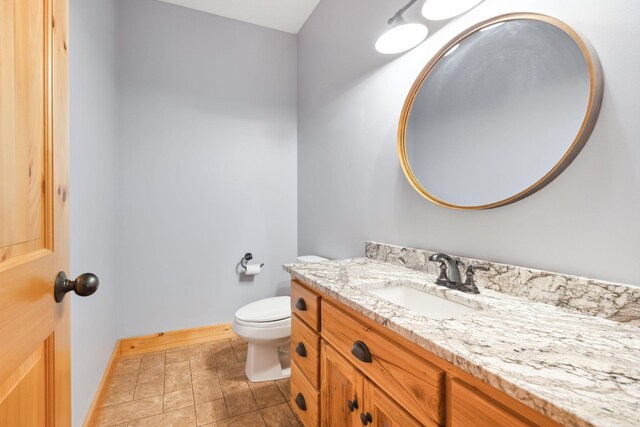 29235 Piney Way, Breezy Point, MN 56472 - half bath with vanity, toilet, baseboards, and stone finish floors