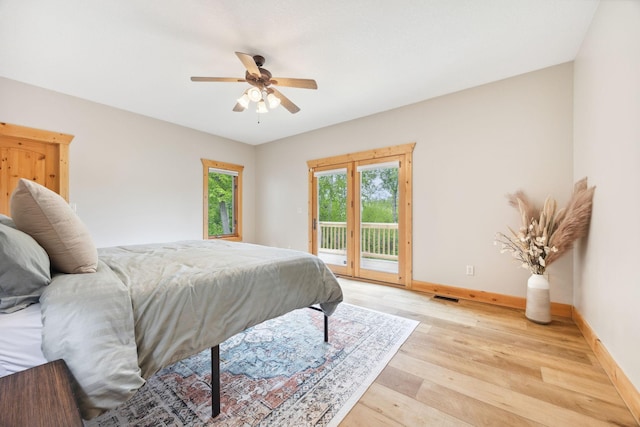 29235 Piney Way, Breezy Point, MN 56472 - bedroom with access to exterior, light wood finished floors, baseboards, and a ceiling fan
