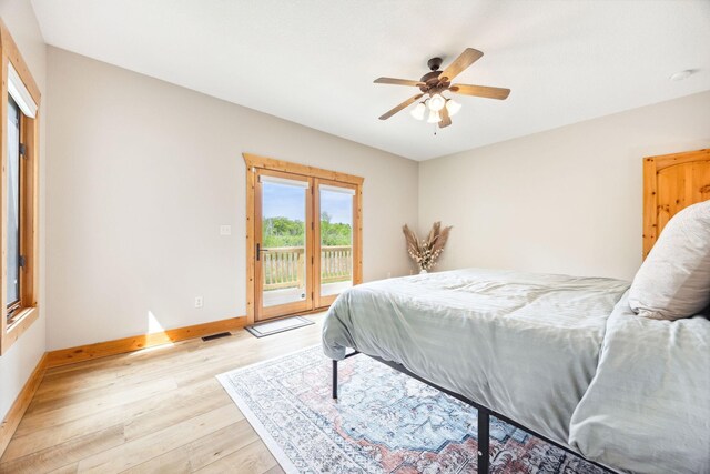 29235 Piney Way, Breezy Point, MN 56472 - bedroom with light wood-style flooring, access to outside, baseboards, and ceiling fan