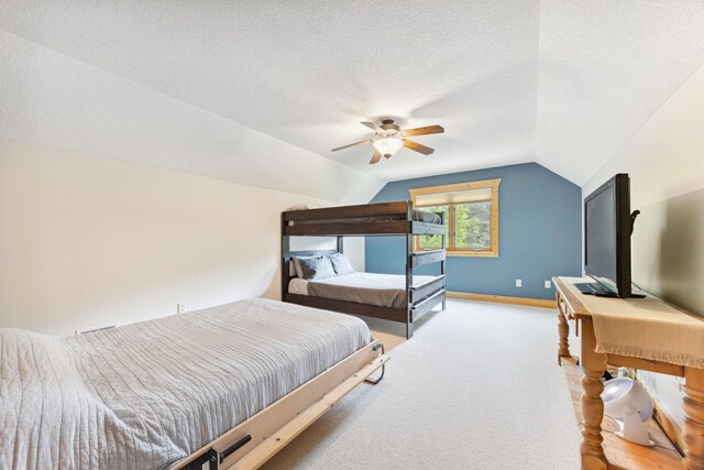 29235 Piney Way, Breezy Point, MN 56472 - carpeted bedroom featuring lofted ceiling, ceiling fan, a textured ceiling, and baseboards