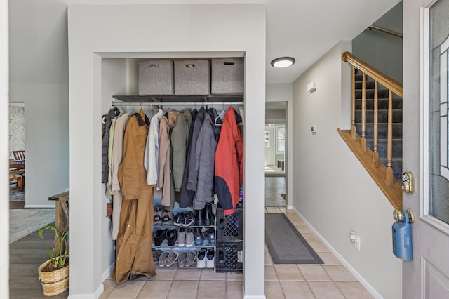 mudroom featuring tile patterned flooring and baseboards